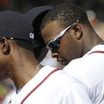 Atlanta Braves outfielders B.J. Upton, left, and his brother Justin Upton, right, return to the dugout during an exhibition baseball game against the Detroit Tigers on Friday, Feb. 22, 2013, in Kissimmee, Fla. (AP Photo/David J. Phillip)