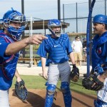 Toronto Blue Jays catchers J.P. Arencibia, left, Josh Thole, center, and Henry Blanco have laugh before a drill during spring training baseball in Dunedin, Fla., on Thursday, Feb. 21, 2013. (AP Photo/The Canadian Press, Nathan Denette)