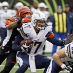 San Diego Chargers quarterback Philip Rivers (17) is sacked by Cincinnati Bengals safety Chris Crocker in the first half of an NFL wild-card playoff football game Sunday, Jan. 5, 2014, in Cincinnati. (AP Photo/David Kohl)