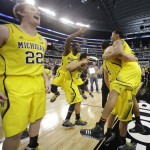 Michigan celebrates after a regional final game against Florida in the NCAA college basketball tournament, Sunday, March 31, 2013, in Arlington, Texas. Michigan won 79-59 to advance to the Final Four. (AP Photo/Tony Gutierrez)