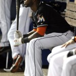 Miami Marlins shortstop Jose Reyes watches from the dugout in the ninth inning during a baseball game against the Arizona Diamondbacks in Miami, Friday, April 27, 2012. The Diamondbacks defeated the Marlins 5-0. Reyes was given the night off by manager Ozzie Guillen after batting .205 in Miami's first 18 games. (AP Photo/Lynne Sladky)