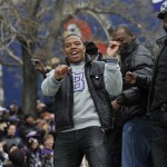 Baltimore Ravens running back Ray Rice, left, dances on a float with other players during a victory parade Tuesday, Feb. 5, 2013, in Baltimore. The Ravens defeated the San Francisco 49ers in NFL football's Super Bowl XLVII 34-31 on Sunday. (AP Photo/Gail Burton)