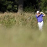 Rory McIlroy, of Northern Ireland, hits down the 14th fairway during the third round of the U.S. Open golf tournament at Merion Golf Club, Saturday, June 15, 2013, in Ardmore, Pa. (AP Photo/Darron Cummings)
