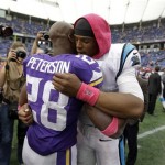 
Minnesota Vikings running back Adrian Peterson, left, hugs Carolina Panthers quarterback Cam Newton following a 35-10 Panthers win in an NFL football game in Minneapolis, Sunday, Oct. 13, 2013. One of Peterson's sons, a 2-year-old in South Dakota, died Friday after an alleged attack in a child abuse case. (AP Photo/Michael Conroy)