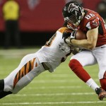 Atlanta Falcons tight end Chase Coffman (86) is hit by Cincinnati Bengals middle linebacker Rey Maualuga (58) during the first half of a preseason NFL football game, Thursday, Aug. 8, 2013, in Atlanta. (AP Photo/John Bazemore)