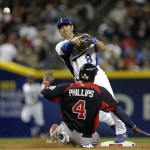 Italy second baseman Nick Punto (8) throws to first for the double play hit into by United States's Ryan Braun after forcing Brandon Phillips out at second during the first inning of a World Baseball Classic game Saturday, March 9, 2013, in Phoenix. (AP Photo/Charlie Riedel)
