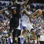 Golden State Warriors' James Southerland, right, goes up for a shot against Phoenix Suns' Markieff Morris in the second quarter of the NBA Summer League championship game, Monday, July 22, 2013, in Las Vegas. (AP Photo/Julie Jacobson)