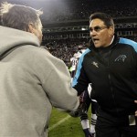 New England Patriots head coach Bill Belichick, left, and Carolina Panthers head coach Ron Rivera shake hands following an NFL football game in Charlotte, N.C., Monday, Nov. 18, 2013. Carolina won 24-20. (AP Photo/Gerry Broome)
