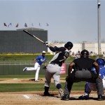  Seattle Mariners' Stefen Romero, center, hits a grand slam against the Kansas City Royals during the fourth inning of an exhibition spring training baseball game, Thursday, March 7, 2013, in Surprise, Ariz. (AP Photo/Marcio Jose Sanchez)