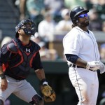 Detroit Tigers' Prince Fielder, right, watches his two-run home run in front of Atlanta Braves catcher Gerald Laird during the first inning of an exhibition spring training baseball game, Wednesday, Feb. 27, 2013, in Lakeland, Fla. (AP Photo/Charlie Neibergall)