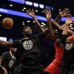 Brooklyn Nets' Reggie Evans, left, fights for a rebound during the first half of the NBA basketball game against the Chicago Bulls at the Barclays Center Wednesday, Dec. 25, 2013, in New York. (AP Photo/Seth Wenig)