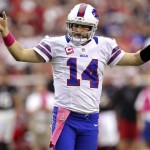 Buffalo Bills quarterback Ryan Fitzpatrick (14) celebrates a touchdown against the Arizona Cardinals during the second half of an NFL football game, Sunday, Oct. 14, 2012, in Glendale, Ariz. (AP Photo/Paul Connors)
