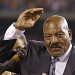 Cleveland Browns Hall of Fame running back Jim Brown waves after being honored in a halftime ceremony at an NFL football game between the Buffalo Bills and the Browns on Thursday, Oct. 3, 2013, in Cleveland. (AP Photo/Tony Dejak)
