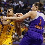 Los Angeles Sparks' Lindsey Harding, left, draws a foul from Phoenix Mercury's Diana Taurasi, right, while heading for the basket during the first half in Game 1 of their WNBA basketball Western Conference semifinal series on Thursday, Sept. 19, 2013, in Los Angeles. (AP Photo/Danny Moloshok)