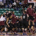 Harvard players run off the bench and celebrate after beating New Mexico during a second round game in the NCAA college basketball tournament in Salt Lake City Thursday, March 21, 2013. Harvard beat New Mexico 68-62. (AP Photo/George Frey)