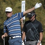 Nick Watney signals wide left from the fifth tee as Bubba Watson stands behind during the first round of the Phoenix Open golf tournament, Thursday, Jan. 31, 2013, in Scottsdale, Ariz. (AP Photo/Matt York)