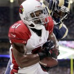Arizona Cardinals cornerback Patrick Peterson, front, intercepts a pass intended for St. Louis Rams wide receiver Brian Quick, rear, in the end zone during the third quarter of an NFL football game, Thursday, Oct. 4, 2012, in St. Louis. (AP Photo/Seth Perlman)
