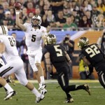 Central Florida quarterback Blake Bortles (5) throws to Kevin Miller (85) as Baylor linebacker Eddie Lackey (5) and Jamal Palmer (92) pursue during the first half of the Fiesta Bowl NCAA college football game, Wednesday, Jan. 1, 2014, in Glendale, Ariz. (AP Photo/Rick Scuteri)