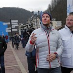 Norway's Aksel Lund Svindal, center, takes a walk through the streets of the Rosa Khutor ski resort in Krasnaya Polyana, Russia, at the Sochi 2014 Winter Olympics, Monday, Feb. 17, 2014. Svindal is leaving the Olympics because he has problems with allergies and fatigue, the Norwegian men's Alpine skiing coach said Monday. (AP Photo/Christophe Ena)