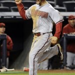 Arizona Diamondbacks' Cody Ross celebrates as he scores on a three-RBI double by Eric Chavez during the 12th inning of a baseball game against the New York Yankees, Thursday, April 18, 2013, at Yankee Stadium in New York. The Diamondbacks won 6-2. (AP Photo/Bill Kostroun)