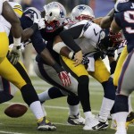  New England Patriots defensive end Rob Ninkovich strips the ball from Pittsburgh Steelers quarterback Ben Roethlisberger (7) in the first quarter of an NFL football game Sunday, Nov. 3, 2013, in Foxborough, Mass. (AP Photo/Charles Krupa)