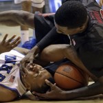 Duke's Tyler Thornton (3) struggles for the ball with Florida State's Okaro White, right, during the first half of an NCAA college basketball game in Durham, N.C., Saturday, Jan. 25, 2014. (AP Photo/Gerry Broome)