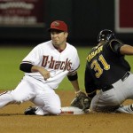 Arizona Diamondbacks' John McDonald, left, tags out Pittsburgh Pirates' Jose Tabata (31) trying to steal second base during the seventh inning in an MLB baseball game Tuesday, April 17, 2012, in Phoenix. The Pirates defeated the Diamondbacks 5-4.(AP Photo/Ross D. Franklin)