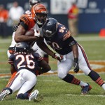 Cincinnati Bengals tight end Jermaine Gresham (84) is tackled by Chicago Bears cornerback Tim Jennings (26) and linebacker James Anderson (50) during the first half of an NFL football game, Sunday, Sept. 8, 2013, in Chicago. (AP Photo/Charles Rex Arbogast)