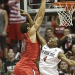  Arizona forward Aaron Gordon dunks over San Diego State guard Dakarai Allen after catching the inbounds pass during the second half of Arizona's 69-60 victory in a NCAA college basketball game Thursday, Nov. 14, 2013, in San Diego. Gordon was also fouled on the play. (AP Photo/Lenny Ignelzi)