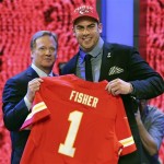 Tackle Eric Fisher from Central Michigan stands with NFL commissioner Roger Goodell after being selected first overall by the Kansas City Chiefs in the first round of the NFL football draft, Thursday, April 25, 2013 at Radio City Music Hall in New York. (AP Photo/Mary Altaffer)