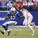 Indianapolis Colts wide receiver T.Y. Hilton (13) makes a reception as Kansas City Chiefs cornerback Dunta Robinson (21) defends during the first half of an NFL wild-card playoff football game Saturday, Jan. 4, 2014, in Indianapolis. (AP Photo/AJ Mast)
