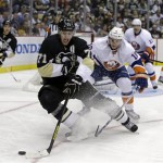 Pittsburgh Penguins' Evgeni Malkin (71) changes direction in front of New York Islanders' Keith Aucoin (10) during the second period of Game 1 of an NHL hockey Stanley Cup first-round playoff series, Wednesday, May 1, 2013, in Pittsburgh. (AP Photo/Gene J. Puskar)