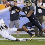 Baylor cornerback Demetri Goodson, right, breaks up a pass intended for Central Florida wide receiver Breshad Perriman during the first half of the Fiesta Bowl NCAA college football game, Wednesday, Jan. 1, 2014, in Glendale, Ariz. (AP Photo/Matt York)