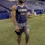 Ohio State running back Carlos Hyde leaves the field after an injury after running the 40-yard dash at the NFL football scouting combine in Indianapolis, Sunday, Feb. 23, 2014. (AP Photo/Nam Y. Huh)