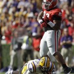 Georgia nose tackle Chris Mayes (93) celebrates after sacking of LSU quarterback Zach Mettenberger (8) during the first half of an NCAA football game, Saturday, Sept. 28, 2013, in Athens, Ga. (AP Photo/John Bazemore)