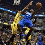  Orlando Magic guard Victor Oladipo (5) puts up a shot while defended by Indiana Pacers guard George Hill in the first half of an NBA basketball game in Indianapolis, Tuesday, Oct. 29, 2013. (AP Photo/R Brent Smith)