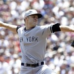 New York Yankees pitcher David Phelps throws against the Minnesota Twins in the first inning of a baseball game, Thursday, July 4, 2013 in Minneapolis. (AP Photo/Jim Mone)