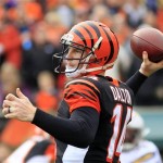  Cincinnati Bengals quarterback Andy Dalton passes against the San Diego Chargers in the first half of an NFL wild-card playoff football game on Sunday, Jan. 5, 2014, in Cincinnati. (AP Photo/Tom Uhlman)