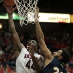 Arizona's Solomon Hill (44) shoots for two points against the defense of Northern Arizona's Gaellan Bewernick (20) during the first half of an NCAA college basketball game at McKale Center in Tucson, Ariz., Saturday, Dec. 3, 2011. (AP Photo/John Miller)