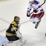 New York Rangers center Derick Brassard (16) jumps out of the way of a teammate's shot as Boston Bruins goalie Tuukka Rask, left, makes a save during the first period in Game 1 of an NHL hockey playoffs Eastern Conference semifinal game in Boston, Thursday, May 16, 2013. (AP Photo/Charles Krupa)