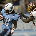 Tennessee Titans running back Chris Johnson (28) gets away from Washington Redskins defender Bacarri Rambo (29) while running 58 yards for a touchdown in the first quarter of a preseason NFL football game on Thursday, Aug. 8, 2013, in Nashville, Tenn. (AP Photo/Wade Payne)