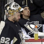 Pittsburgh Penguins goalie Tomas Vokoun (92) stands next to fellow goalie Marc-Andre Fleury (29) during a third period time out in Game 1 of the NHL hockey Stanley Cup Eastern Conference finals against the Boston Bruins in Pittsburgh, Saturday, June 1, 2013. The Bruins won 3-0. (AP Photo/Gene J. Puskar)