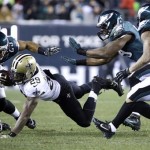 New Orleans Saints' Khiry Robinson (29) dives for extra yardage against Philadelphia Eagles' Nate Allen (29), DeMeco Ryans, second from right, and Patrick Chung (23) during the first half of an NFL wild-card playoff football game, Saturday, Jan. 4, 2014, in Philadelphia. (AP Photo/Matt Rourke)