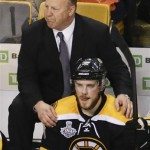 Boston Bruins head coach Claude Julien, watches play with center Tyler Seguin (19) during the second period in Game 4 of the NHL hockey Stanley Cup Finals against the Chicago Blackhawks, Wednesday, June 19, 2013, in Boston. (AP Photo/Charles Krupa)