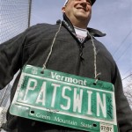 New England Patriots fan Jason Scheinbart wears his autographed Vermont license plate in Indianapolis, Friday, Feb. 3, 2012. The New England Patriots are scheduled to face the New York Giants in NFL football's Super Bowl XLVI on Feb. 5. (AP Photo/David Duprey)