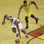Miami Heat small forward LeBron James (6) steals the ball from Indiana Pacers small forward Paul George (24) during the first half of Game 7 in their NBA basketball Eastern Conference finals playoff series, Monday, June 3, 2013 in Miami. (AP Photo/Wilfredo Lee)
