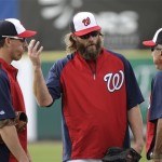 Washington Nationals outfielder Jayson Werth, center, and first baseman Adam LaRoche, left, talk with manager Davey Johnson, right, before an exhibition spring training baseball game against the Miami Marlins Wednesday, Feb. 27, 2013, in Viera, Fla. (AP Photo/David J. Phillip)