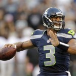  Seattle Seahawks quarterback Russell Wilson drops back to pass against the Oakland Raiders in the first half of a preseason NFL football game Thursday, Aug. 30, 2012 in Seattle. The Seahawks won 21-3. (AP Photo/Stephen Brashear)