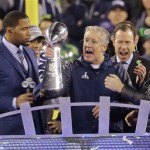 Seattle Seahawks head coach Pete Carroll holds up the Lombardi Trophy after the NFL Super Bowl XLVIII football game against the Denver Broncos, Sunday, Feb. 2, 2014, in East Rutherford, N.J. The Seahawks won 43-8. (AP Photo/Chris O'Meara)