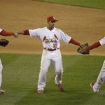 St. Louis Cardinals' Allen Craig (21), Jon Jay (19) and Adron Chambers celebrate after the ninth inning of Game 4 of baseball's National League championship series against the San Francisco Giants Thursday, Oct. 18, 2012, in St. Louis. The Cardinals won 8-3 to take a 3-1 lead in the series. (AP Photo/Mark Humphrey)